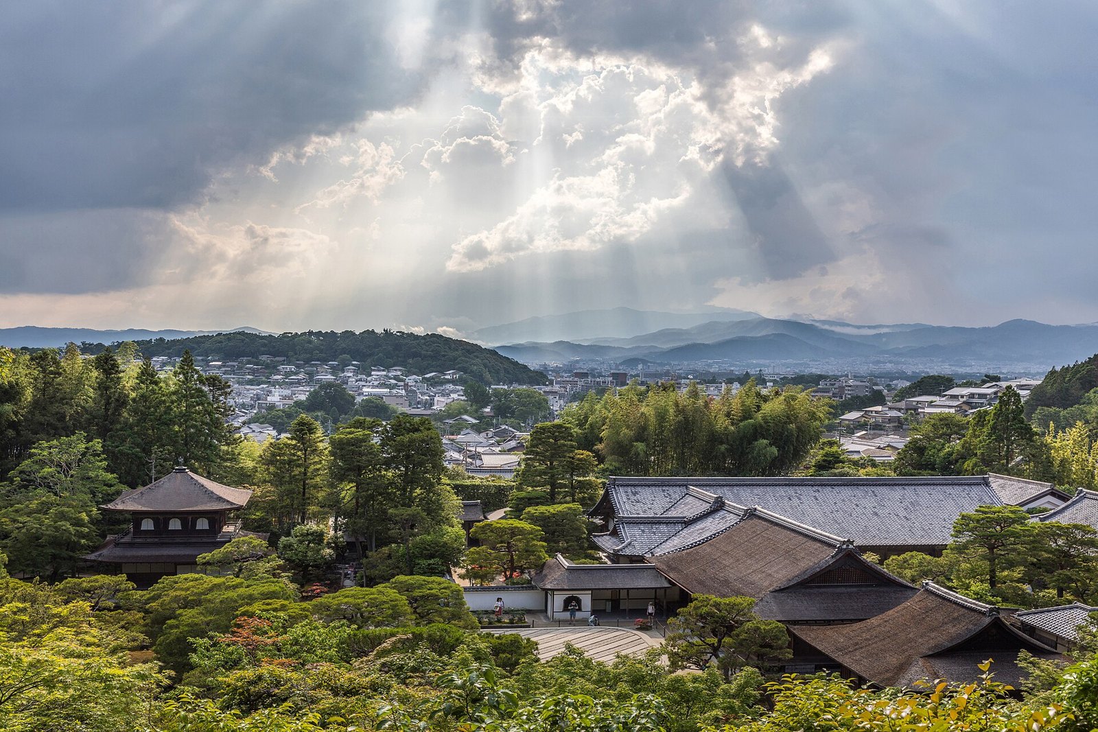 Киото: Sunlight through clouds and view of Ginkaku-ji Temple from above, Kyoto, Japan